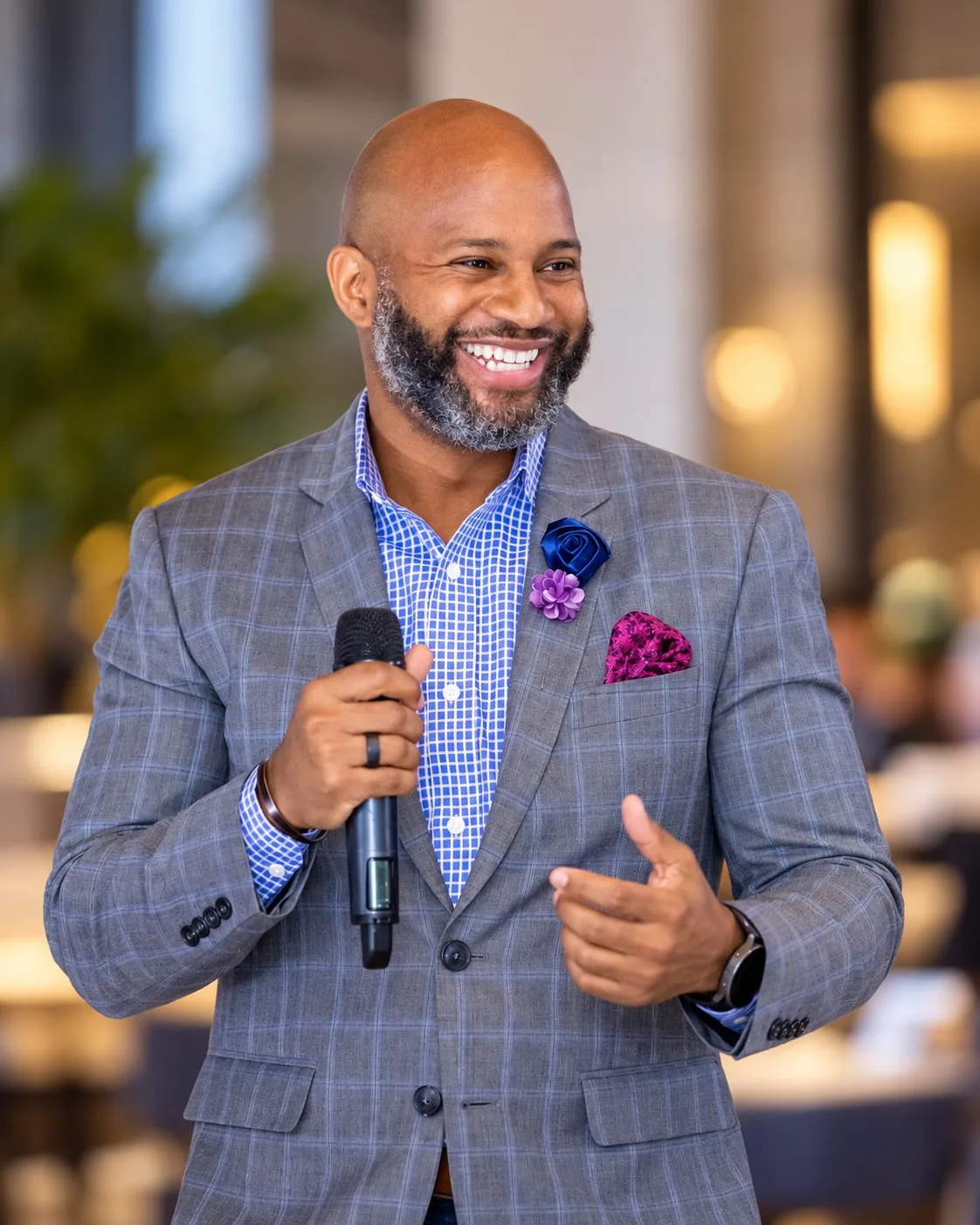 Jemar Ward speaking on stage with a microphone